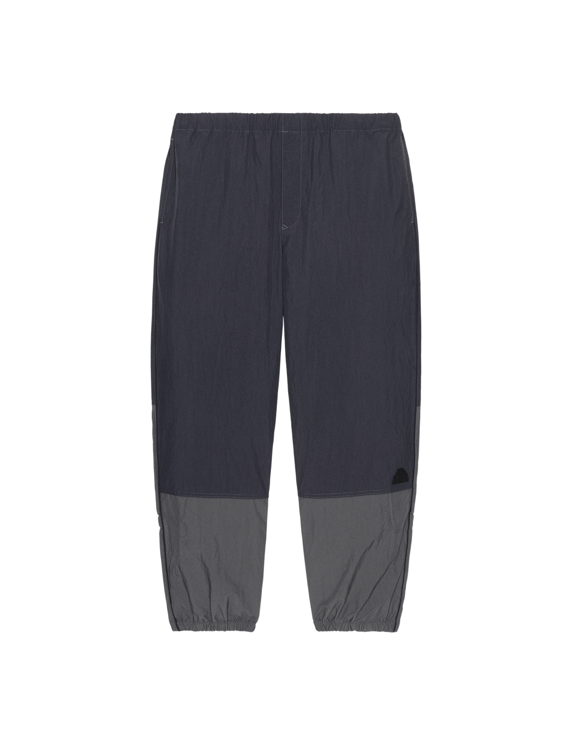 C.E CAV EMPT(シーイー) 2026FW NYLON SPLIT WARM UP PANTS ナイロンウォームアップパンツ ブラック フロント