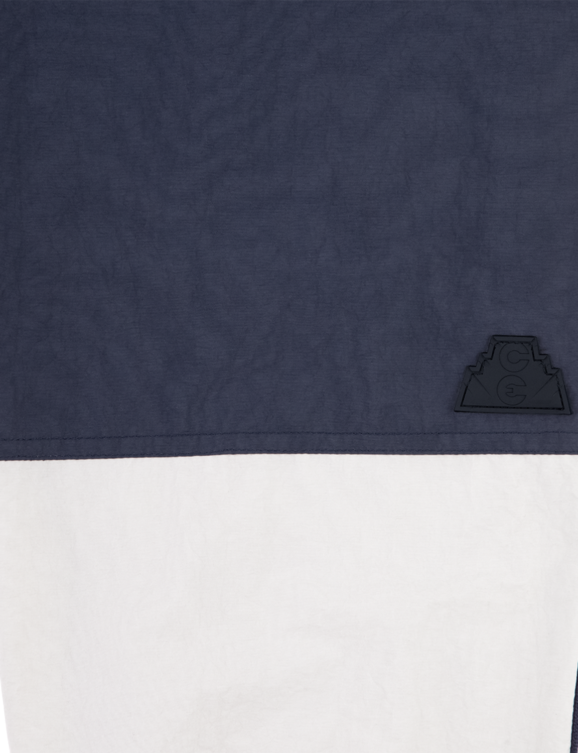 C.E CAV EMPT(シーイー) 2026FW NYLON SPLIT WARM UP PANTS ナイロンウォームアップパンツ ネイビー 切り替えとポケットのディテール